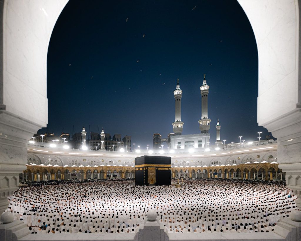 A breathtaking night view of pilgrims at the Kaaba in Masjid al-Haram, Makkah, Saudi Arabia.
